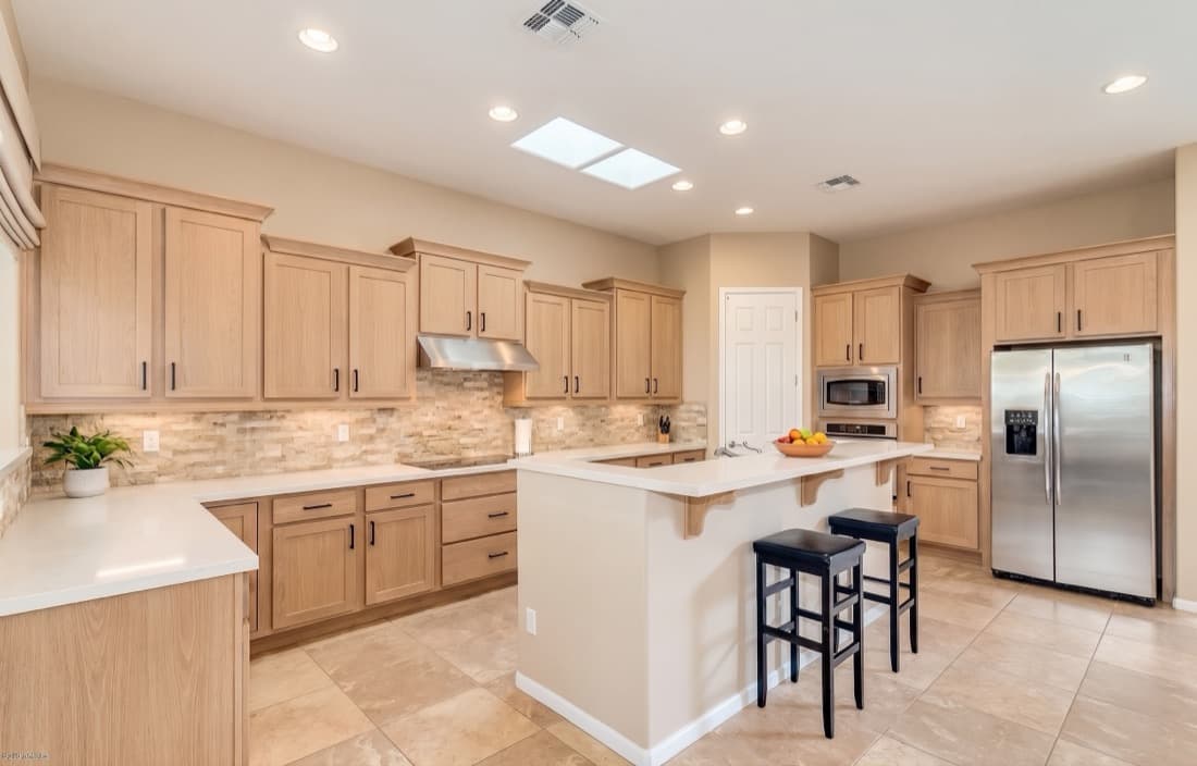 The same kitchen rendered as Natural Light Wood