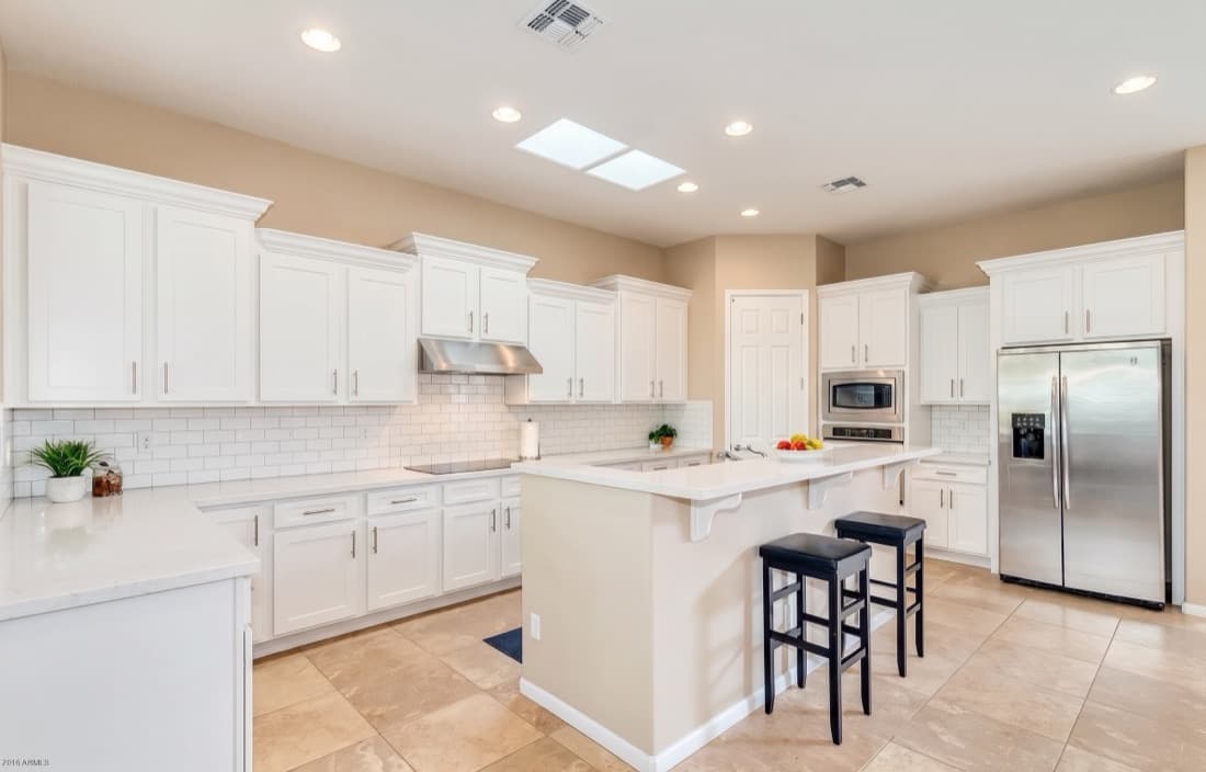 The same kitchen rendered as Crisp White Shaker